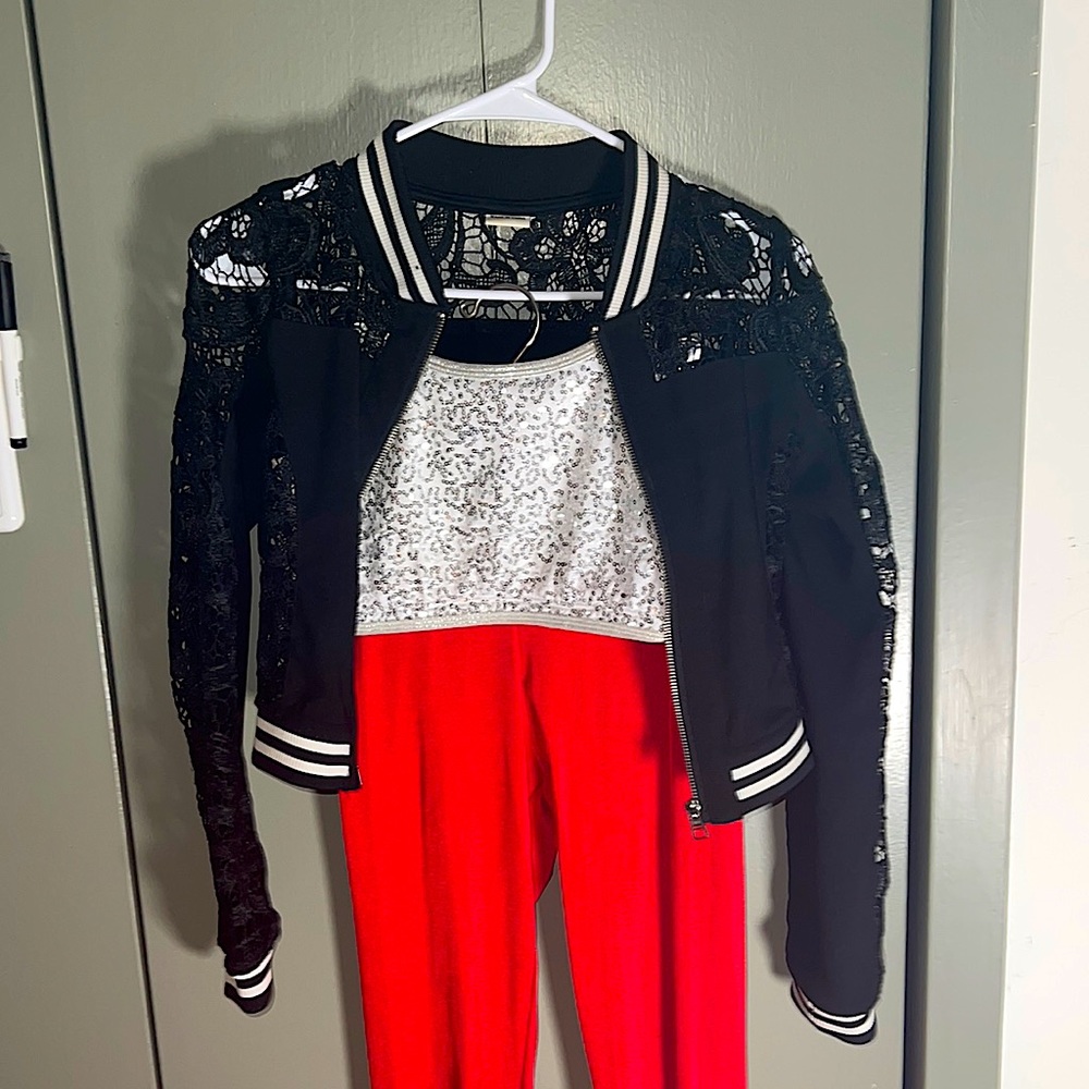 red and black dance costume with sequined top and lace track jacket